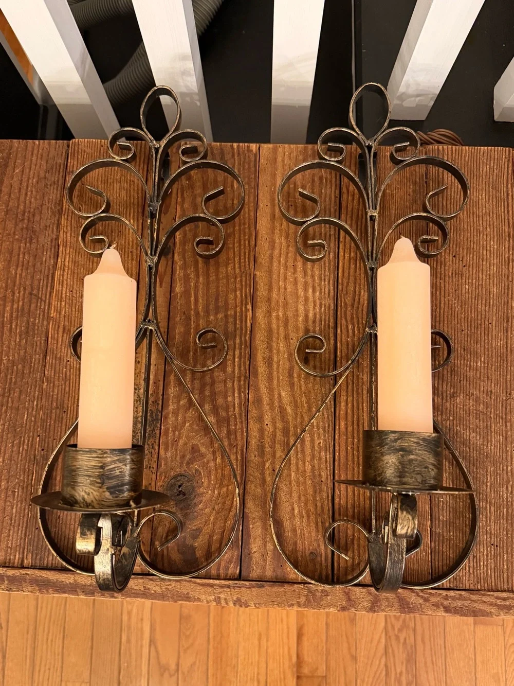 Rustic Scroll Metal Wall Sconce Pair with Cream Candles